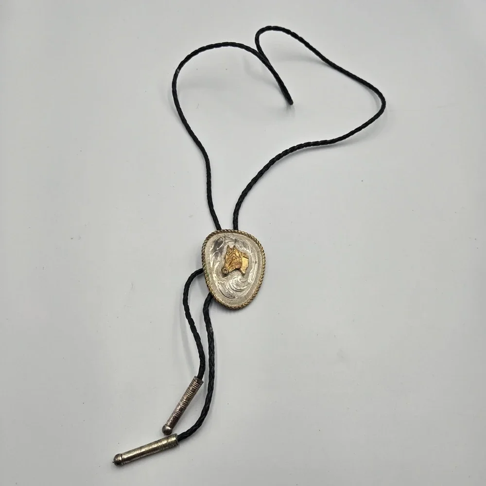 Vtg Southwestern Bolo Tie Silver Gold Tone Horse Head Black Braided Cord‎